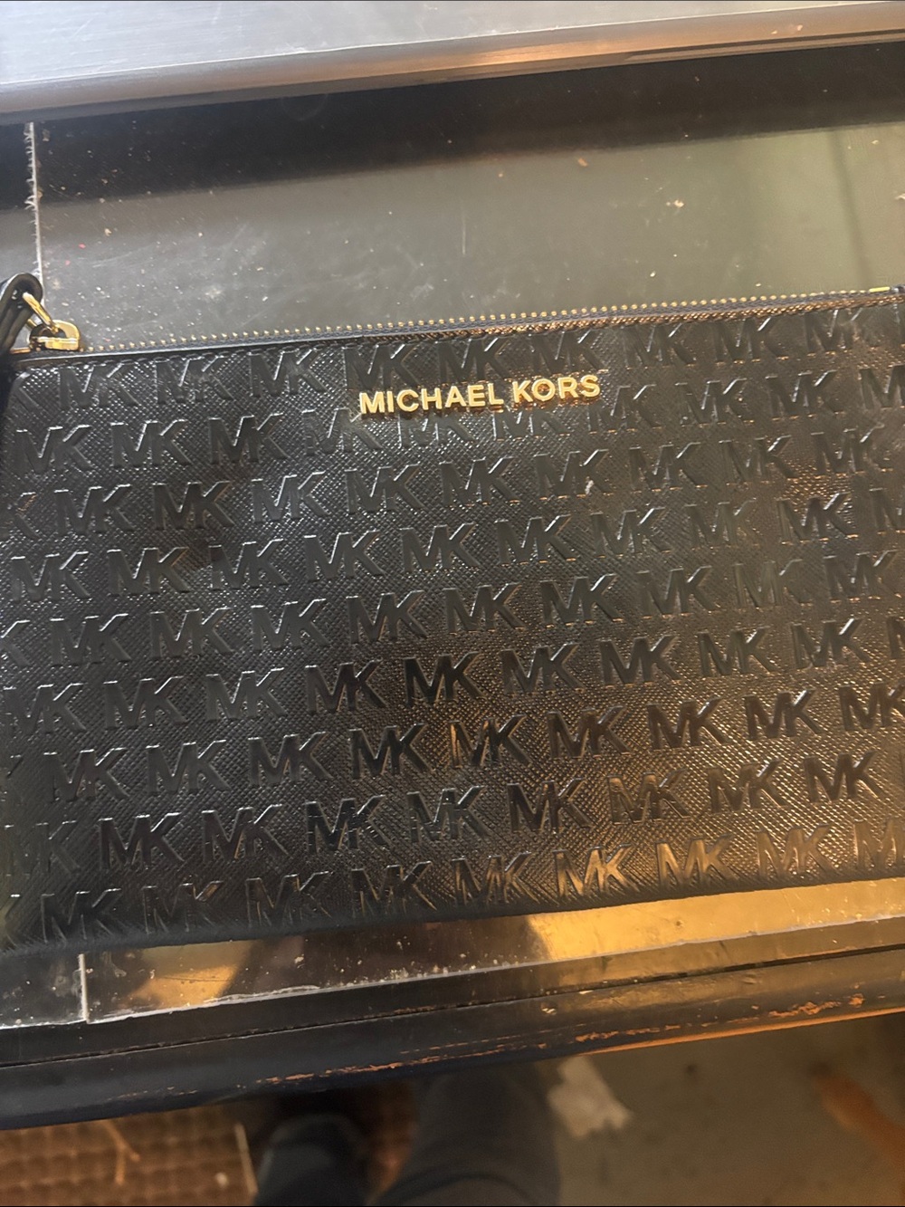 Michael Kors Black Embossed MK Logo Zip Pouch with Gold-tone Branding